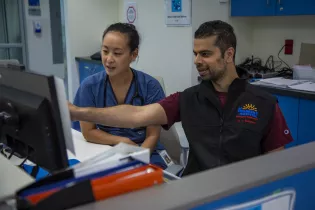 Two people looking at a computer in BC Children's Hospital emergency department