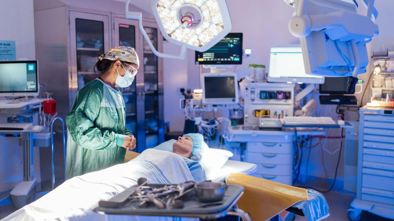 A doctor speaking with a patient before a procedure