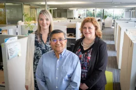 Three smiling people