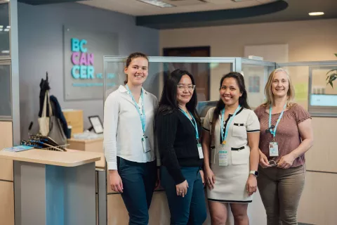 Four female staff smiling