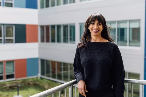 A physician standing outside of a hospital