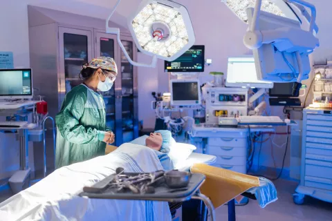 A doctor speaking with a patient before a procedure