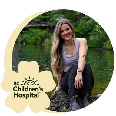 A BC Children's Hospital employee posing for a photo outside