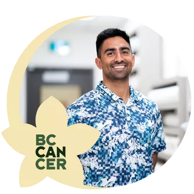 A BC Cancer employee posing for a photo inside a hospital