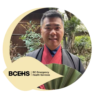 Picture of a man holding an ornamental fan