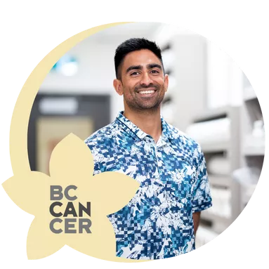 A BC Cancer employee posing for a photo inside a hospital