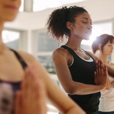 Three women in a yoga class